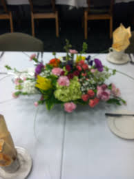Since less is more here, it's actually a very affordable way to create a centerpiece. Dinner Party Flowers By Arrangements
