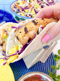 In a small bowl mix mayonnaise, apple cider vinegar, orange juice, adobo sauce, and salt. Easy Grilled Fish Tacos With Zesty Pineapple Coleslaw