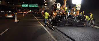 These machines can paint road markings in seconds. Arrow Road Construction Healy Asphalt Company Llc