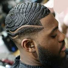 Smiling businessman waving hand at camera near multicultural colleagues on blurred foreground isolated on grey. 10 Interesting Waves Hairstyles For Black Men Update Hairstylecamp
