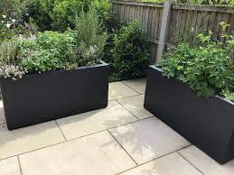 This rustic style kitchen garden trough planter from forest can serve a multitude of purposes to suit you and you garden. Outdoor Fiberglass Trough Black Matt Textured Planter W40 H80 L200 Cm 640 Ltrs Cap From 816 99 Getpotted Com