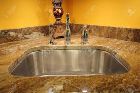silver sink and granite countertop