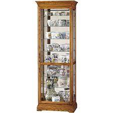 Good & gracious lighted glass curio cabinet with mirrored back for private collectibles display console cabinet with adjustable shelf 38.25 w, oak. Howard Miller Chesterfield Ii Curio Cabinet 680 288 Golden Oak Glass Display Shelf Case With Light Creative Clock Shop Online For Digital Clocks Rhtyhm Clock And More