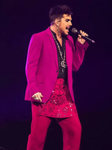 At the Avicii Tribute Concert on December 5, 2019, Adam Lambert honored  Avicii with a high-energy rendition of “Lay Me Down.” Dressed in a bold  pink suit, Lambert lit up the stage