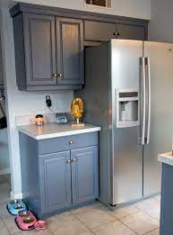 Glitter And Goat Cheese Kitchen With Dark Gray Cabinets And Gold Hardware Kitchen Gold Kitchen Hardware Grey Cabinets