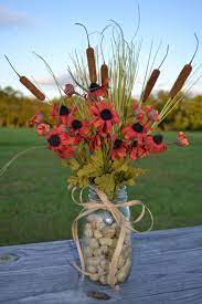 Play around with various textures and color combinations by pairing cattails with sunflowers, hydrangea, goldenrod, green dianthus, millet, scabiosa, roses, and wheat. 29 Cattail Centerpieces Ideas Centerpieces Flower Arrangements Fall Arrangements