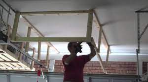 To make this diy project, you will need deck screws, a handsaw, some plywood, a power drill, angle brackets, and an oriented strand board. Garage Overhead Storage Timelapse Youtube