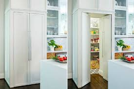 It's located in the butler's pantry, with the brick walls, and leads to the food pantry. Door To Garage Through Hidden Walk In Pantry