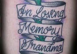 A blooming blue flower with side slogan. 25 Memorial Grandma Tattoos