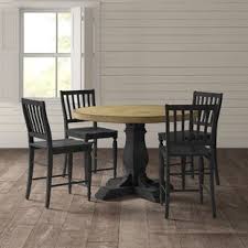 The table's clean lines give it a casual silhouette, while details like picture frame molding around the table apron and cup pull hardware exude farmhouse style. Farmhouse Rustic Counter Height Dining Sets Birch Lane