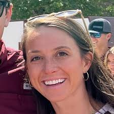Students taking pictures of anti-bullying sign