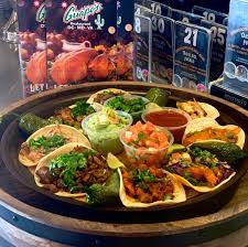 A crispy steak fajita taco, a soft chicken fajita taco with sauteed onions and peppers and a chicken enchilada topped with sour cream sauce. Guapo S Manassas Rotisserie Facebook