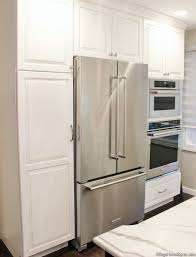 Organize your pantry with pantry organizers from the container store! White Pantry Cabinet Counter Depth Refrigerator And Built In Wall Ovens In A Bettendorf Iowa Kitchen White Pantry Pantry Cabinet Pantry Wall