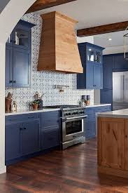 A navy blue backsplash will add a drama and completely change the tone of a kitchen. 4 Reasons To Jump On The Navy Cabinet Kitchen Trend Nebs