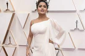 The like a boss star chose a billowing white asymmetrical gucci gown with a single cape sleeve and a. Celebrity Salma Hayek On The Red Carpet At The 2020 Oscars Fashioviral Net Leading Fashion Beauty Lifestyle Magazine And Community