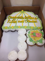 By assembling them first and then layering the frosting over them, it gives the illusion of a full cake. Pin By Nicole Quides Nihipali On Party Stuff Baby Shower Cupcakes Baby Cake Cupcake Cake Designs
