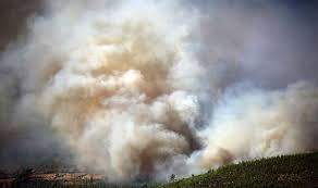Citizens in the mersin region of southern turkey watch fire crews battling a forest blaze. Fm6ybet3xhccym