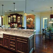 Home styles distressed oak top kitchen island and two barstools. Photos Hgtv
