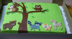 For The Cake I Ordered Just A Plain Sheet Cake From Walmart And Had Them Ice It In Gr Baby Shower Sheets Woodland Baby Shower Decorations Baby Shower Woodland