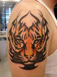 This is a unique tiger tattoo that is combined with a background of tribal art. The Best Tribal Tiger Tattoo On Arm Tattoo Photo Doti38 Tribal Tiger Tattoo Cool Shoulder Tattoos Tribal Shoulder Tattoos