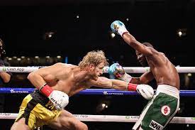 Floyd mayweather, right, throws a punch at logan paul, left, during an exhibition boxing match at hard rock stadium, sunday, june 6, 2021, in miami gardens, fla. 6inbre7so7n9tm