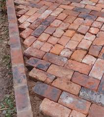 Smooth out the excavated area as much as possible using a garden rake. How To Lay A Patio From Reclaimed Bricks Alice De Araujo