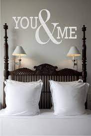 Navy blue grass cloth and navy painted blue trim wraps the master bedroom. You Me Quote The Walls Home Home Decor Home Decor Bedroom