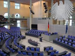 The bundestag eagle hangs suspended from the ceiling of the plenary chamber of the bundestag in berlin, germany, on thursday, sept 10, 2015 shots angela merkel, germany's chancellor, wolfgang schauble, germany's finance minister Bundestag Change Here