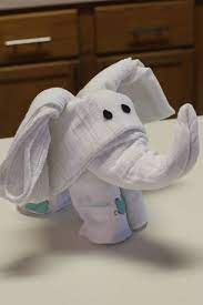 Does it seem like everyone you know is having a baby right now? Turn Swaddling Blankets Into An Elephant Baby Shower Diy Towel Animals Diy Baby Stuff