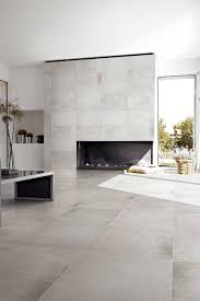 Minimalist Living Area With Gray Ceramic Floor Tiles And Modern Fireplace Nonagon Style Living Room Tiles Tile Floor Living Room Floor Tile Design