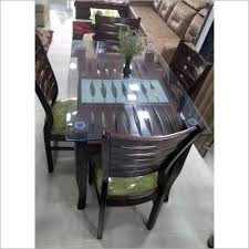 A glass top is easy to clean with a spray cleaner and simple wiping, which makes it perfect for a kitchen or dining room table that is always in contact with food, a kids play table or a coffee table. Glass Top Wooden Dining Table Set At Best Price In Mumbai Maharashtra Goodluck Trader