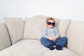 Efolki boho throw pillow covers for couch and bed 18x18 set of 6, boho decor, faux leather, farmhouse, ivory white square decorative throw pillows covers 4.7 out of 5 stars 2,036 $47.97 $ 47. Little Boy With Oversized Sunglasses Sitting On Couch Stockphoto