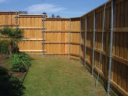 Building A Wood Fence With Metal Posts Wood Fence Building A Fence Fence Design