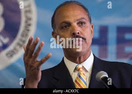 Detroit mayoral candidate Freman Hendrix, left, talks with his wife Elaine  Lewis-Hendrix while voting in the Detroit primary