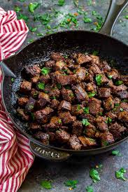 Cook steaks in the hot skillet until lightly browned on the bottom, 2 1/2 minutes. Steak Bites With Garlic Buter Dinner Or Steak Appetizers Confetti Bliss