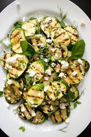 Grilled Zucchini With Feta Cheese And Lemon The Delicious Plate Recipe Grilled Zucchini Vegetable Platter Grilling Recipes