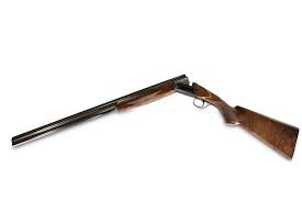 Elegant sporting gun with game scenes on a sideplate receiver with gold inlays. Perazzi Mx16 Reviewed By Sporting Gun Magazine