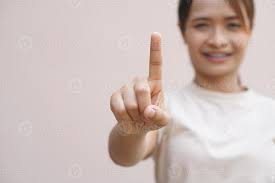 A person is pressing a check mark button