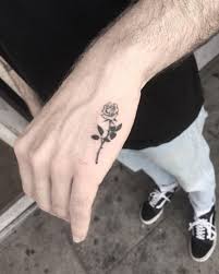 Awesome black rose tattoo on hand for men. 1001 Ideas For A Minimalist Charming And Small Tattoo