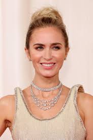 Behold: The “floating strap”! 👀 Emily Blunt and Florence Pugh both rocked  Oscars gowns with the sartorial feature. What are your thoughts — is it a  new trend?