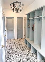 A mudroom should be designed so that it is easy to enter and exit and spacious enough that family members do not have to move out of the way so that others can walk in or out. Merola Tile Mudroom With Patterned Merola Tile Patterned Merola Tile Patterned Merola Tile Patternedmerolatile Merolatile Pat Mudroom Makeover Mudroom House