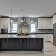 .white and grey kitchen features white cabinets, grey granite countertops, and a simple 3 pendant lighting it is all at once posh and modern. 75 Beautiful Light Wood Floor Kitchen Pictures Ideas July 2021 Houzz