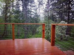 Use the adjustable wrench and wire crimper to compress the end of the spindle around the wire, and then hold and turn the spindle with the adjustable wrench at each end to pull the wire taut. Top 70 Best Deck Railing Ideas Outdoor Design Inspiration