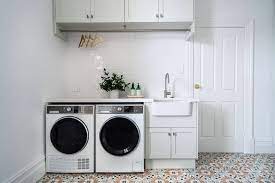Bead board walls, granite countertop, beautiful blue gray washer dryer. The Top 70 Laundry Room Sink Ideas