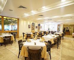 The ambassador dining room two fireplaces and is always festively decorated around the christmas season. Al Diwan Restaurant Ambassador Collection