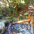 It works by filling a partly hollowed bamboo rod with water so it tips, spills the water. Shishi Odoshi Wikipedia
