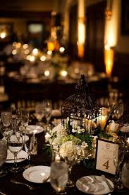 Check out this round reception tables with black tablecloths and see more inspirational photos on theknot.com. Tips For Looking Your Best On Your Wedding Day Luxebc Wedding Table Settings Reception Table Settings White Weddings Reception