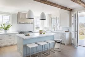 Bar stools can complement a kitchen island table, but they can be uncomfortable and can look out of place if they are too big or too small in proportion to the countertop. Light Blue Center Island With Sleek Bar Stools Transitional Kitchen