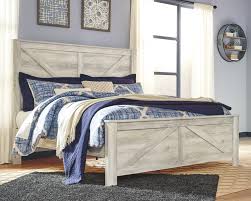 The elegant design features solid wood posts with a sleek finished bed frame. Bellaby Queen Crossbuck Panel Bed B331b6 154 157 196 Complete Beds Furniture Factory Outlet
