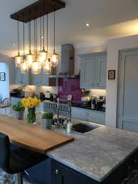 Wooden cupboards give this modern kitchen a fun twist, without distracting from the light, clean palette. 1909 Range